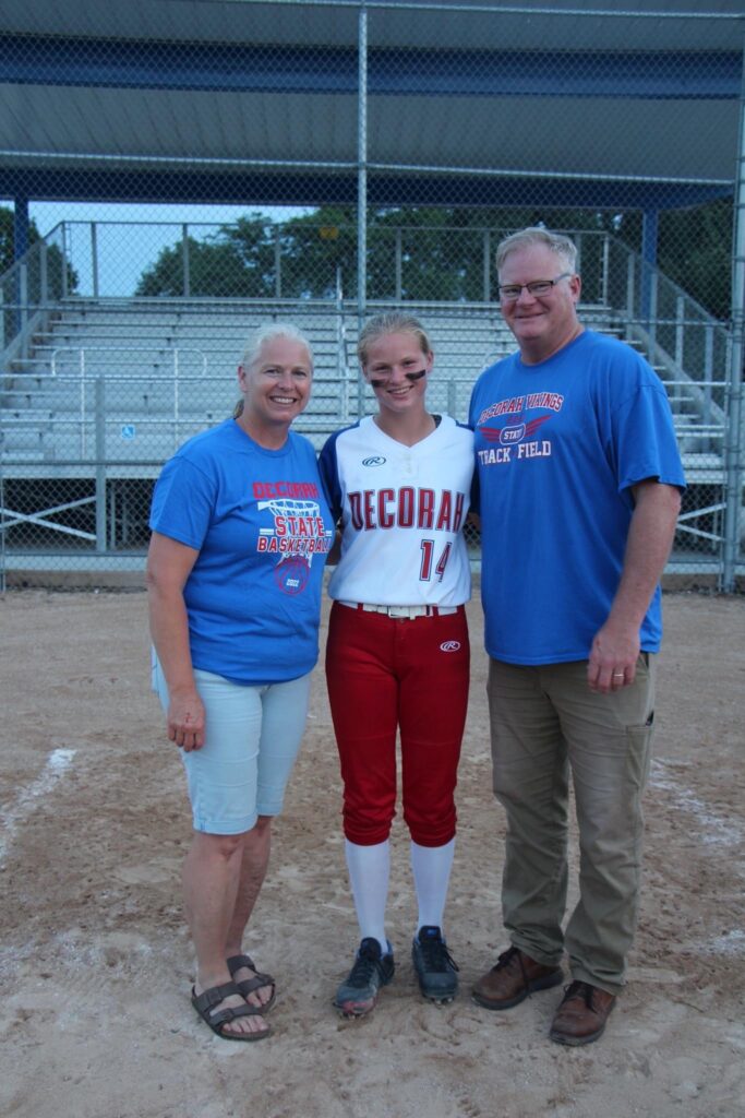 Parents and softball player