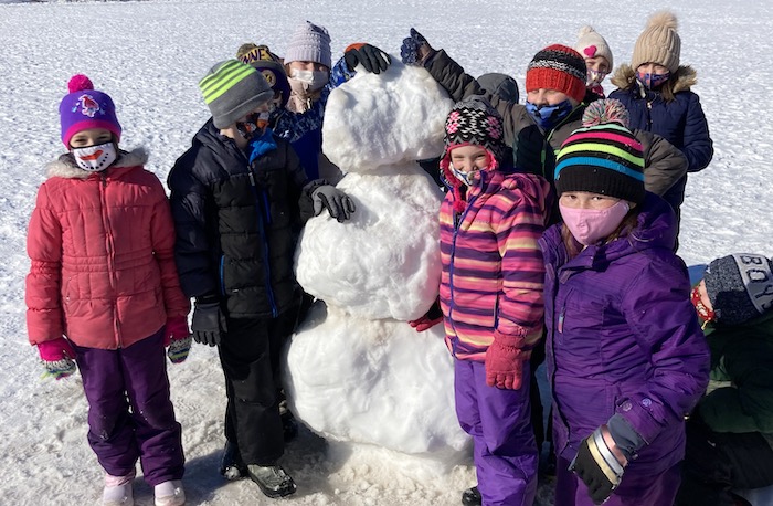 Snowman and students