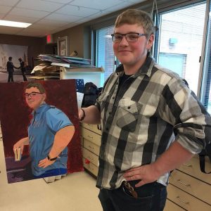 Student with self portrait