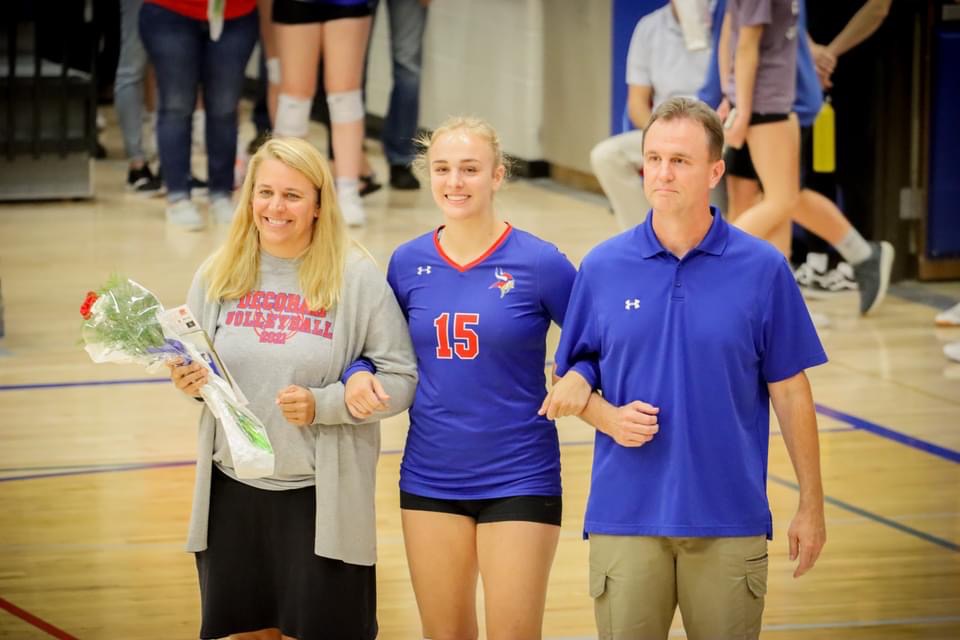 Volleyball senior with her parents