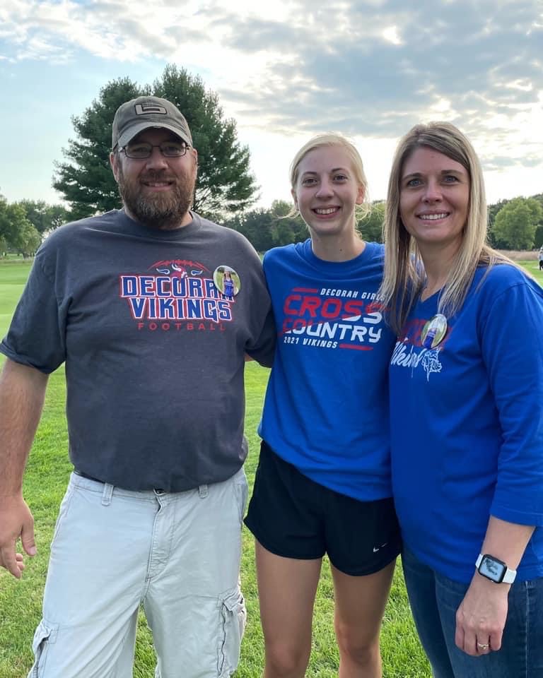 Cross country runner with her parents
