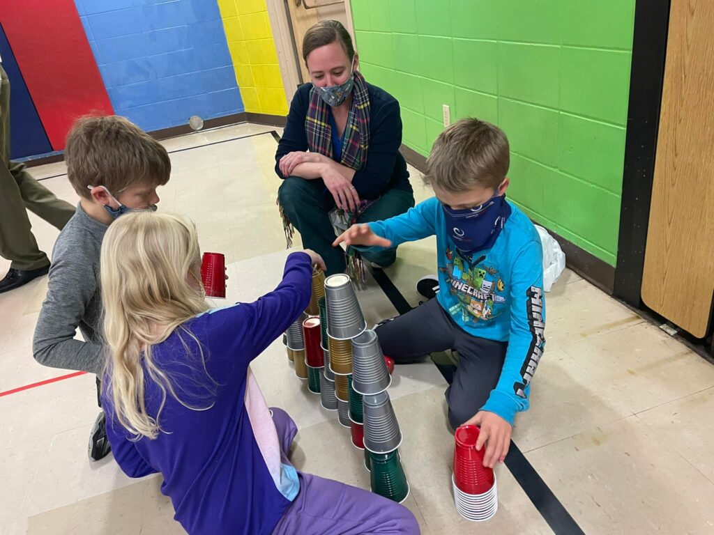 Student groups stacking cups