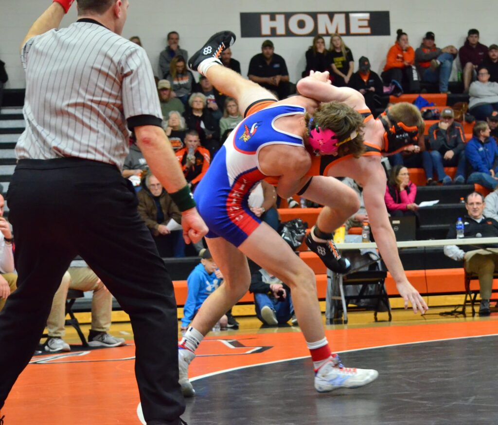 Male wrestler throwing his opponent to the mat