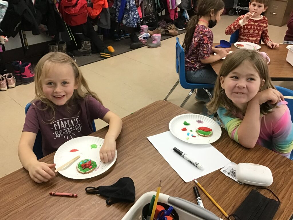 Students with decorated cookies