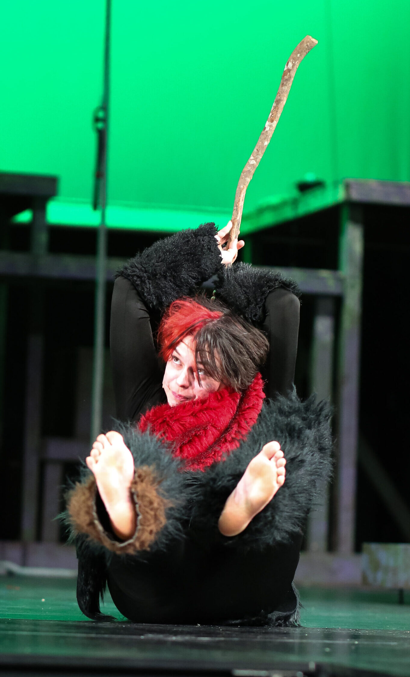 An ape hangs from a branch in Tarzan the Musical