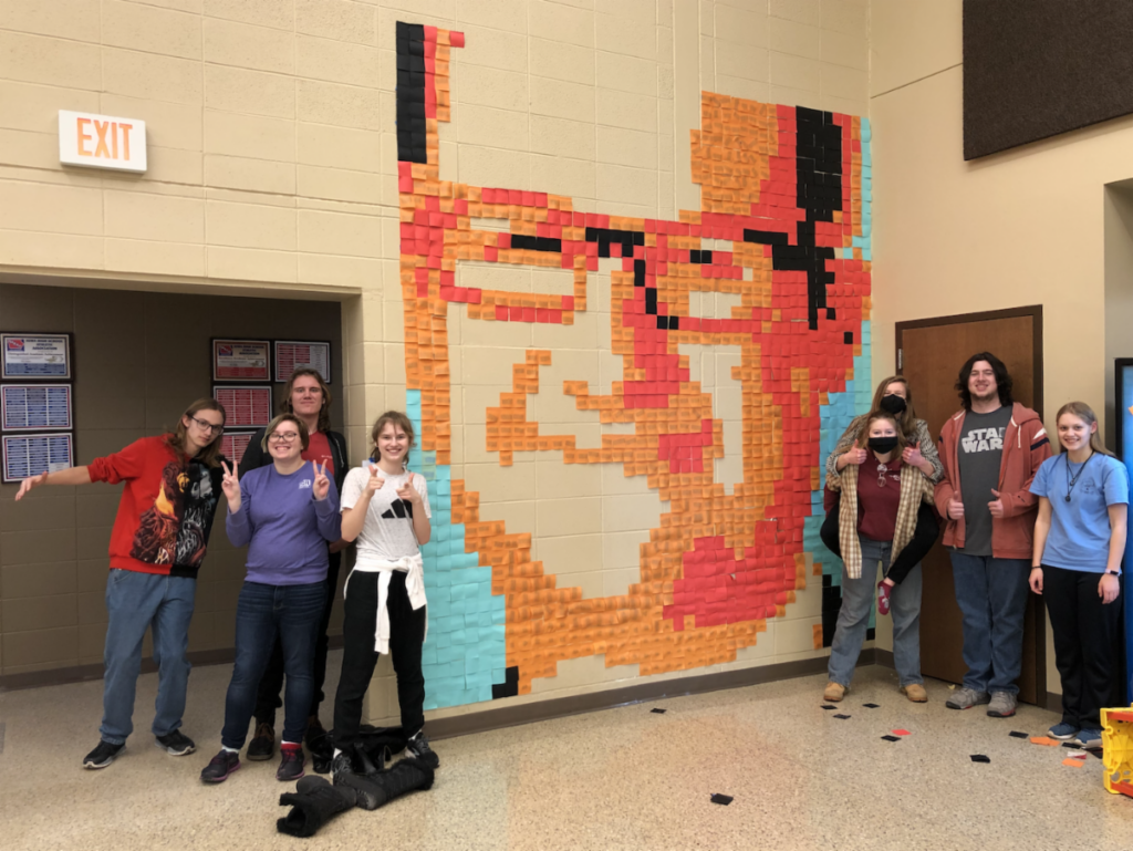Highschool art students stand by their creation of teacher Andy Carlson