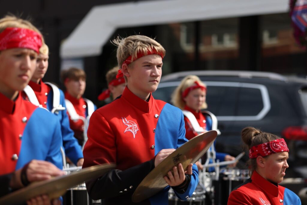Band member with cymbals