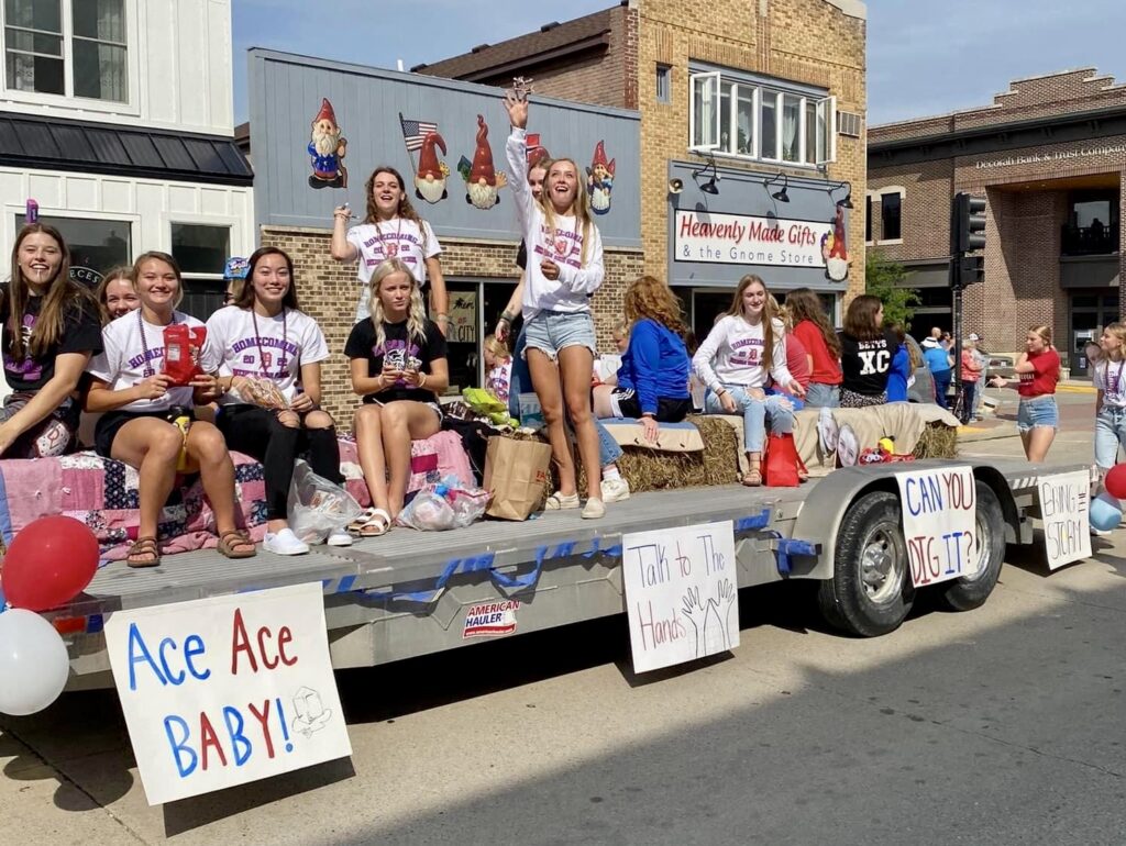 volleyball players in homecoming parade