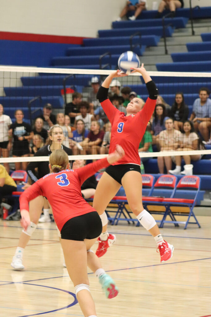 Volleyball setter setting up a hitter