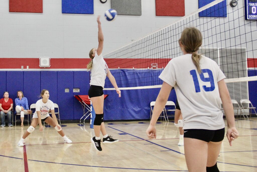 Volleyball player spiking the ball